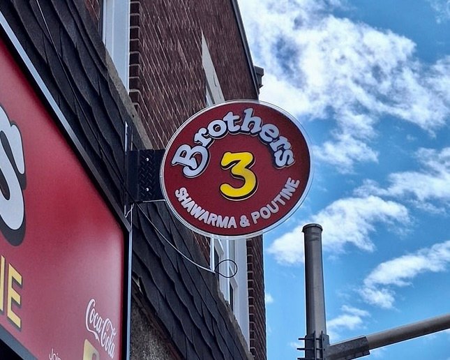 Custom blade sign designed for a restaurant in Ottawa.