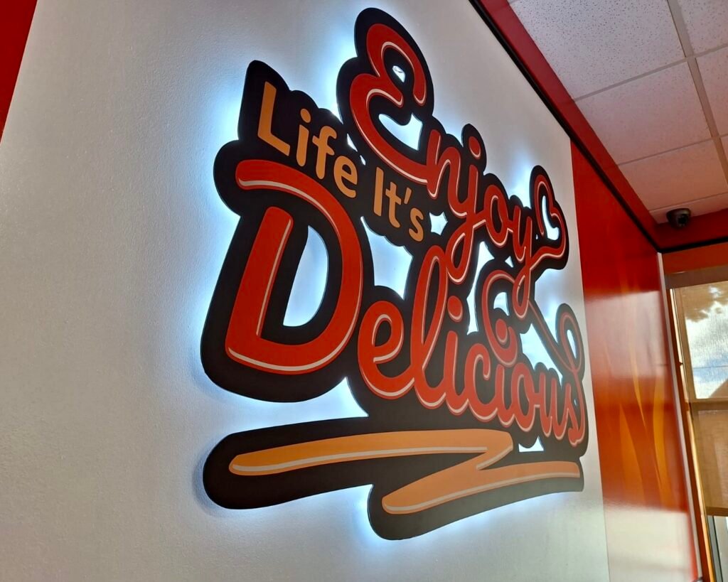 Modern indoor restaurant sign providing branding and visibility in Ottawa.